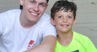 Summer Camp Teen Counselor with Camper