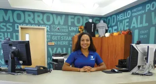 YMCA employee at front desk