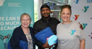 three people at the riverfront ymca