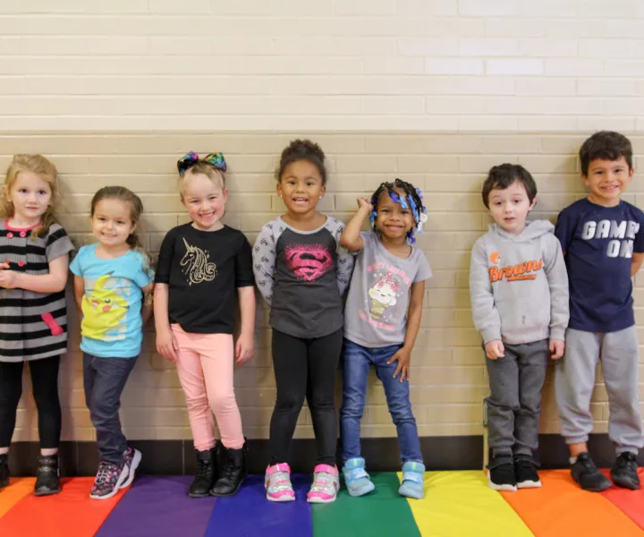 kids on rainbow rug