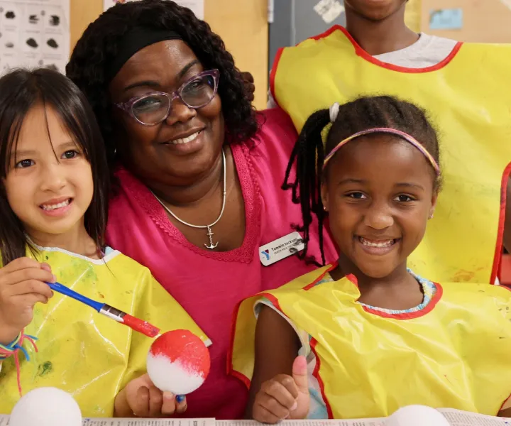 Tammie with three students