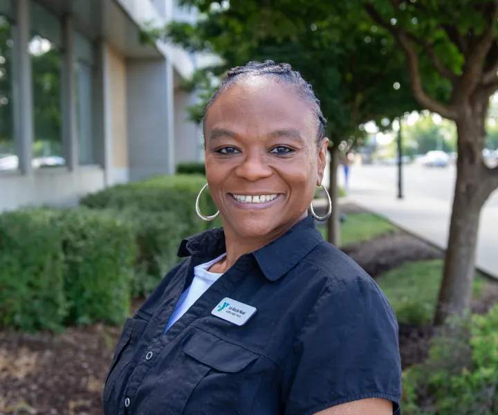 La Kecia smiling in a black top