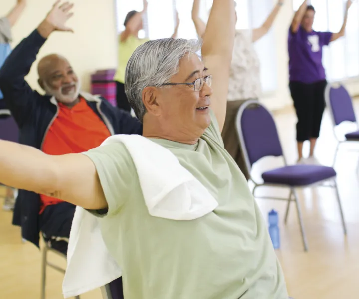 Older man in a Solver sneakers fitness class