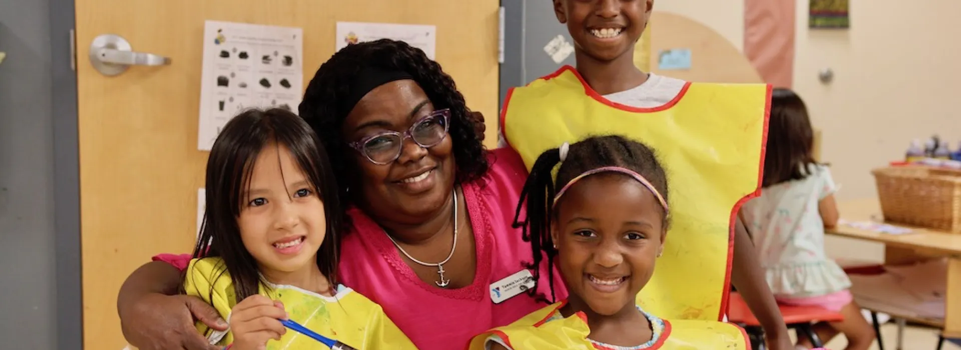 Tammie with three students